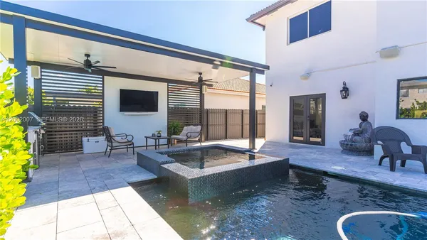 a very nice looking living room with a large window
