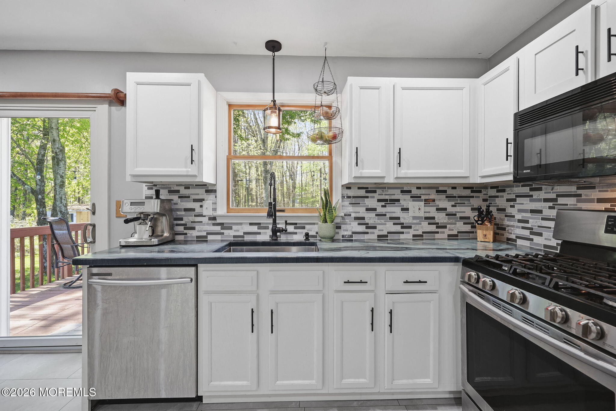 356 Leesville Road Jackson, NJ 08527 - Photo 18 of 46 a kitchen with white cabinets and appliances