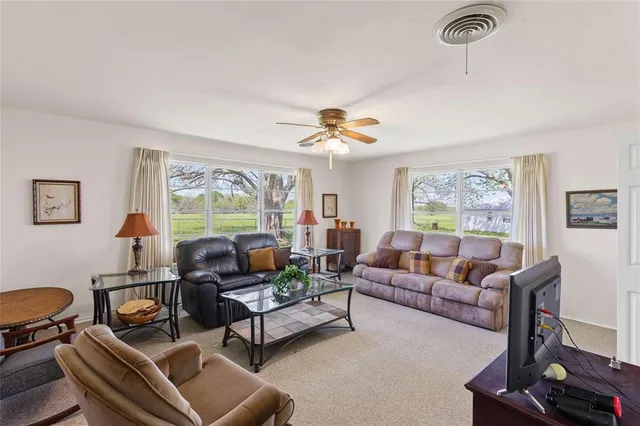 a living room with furniture and a window