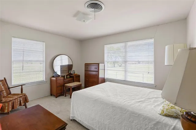 a bathroom with a sink toilet and mirror