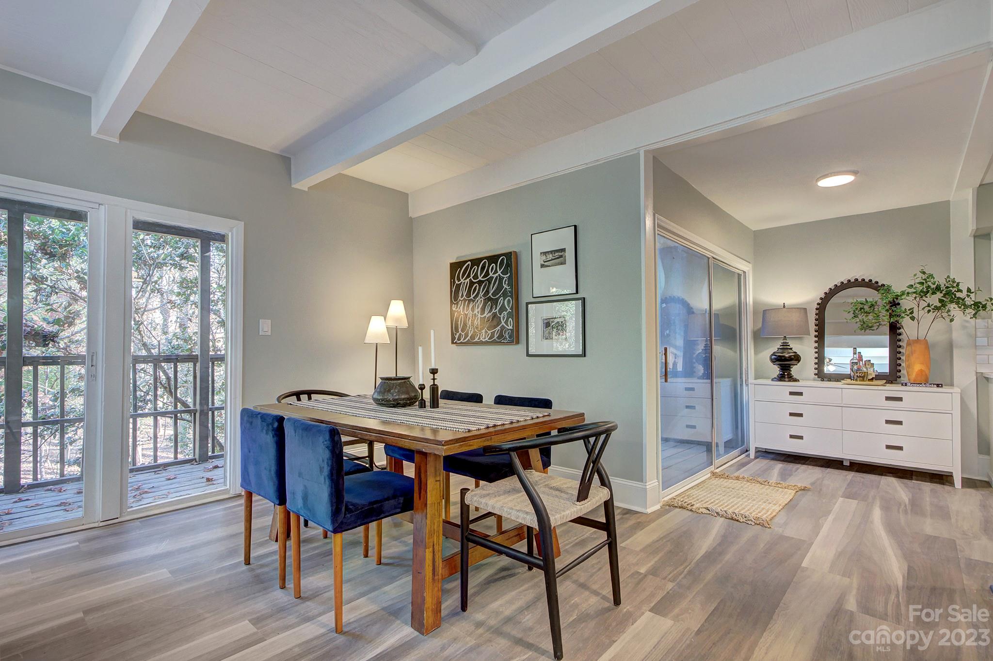 4719 Rounding Run Road Charlotte, NC 28277 - Photo 14 of 48 a view of a dining room with furniture and wooden floor