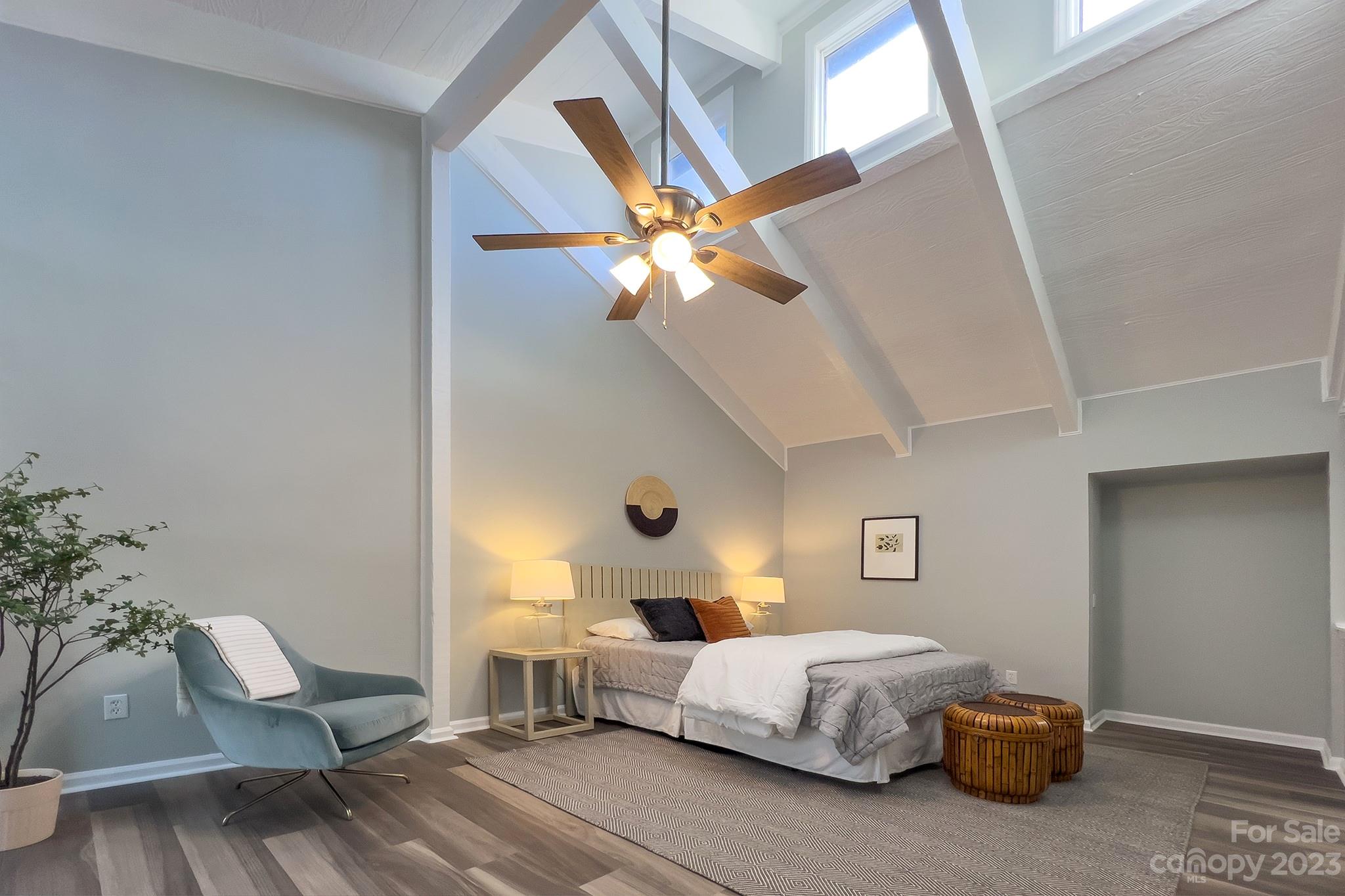 4719 Rounding Run Road Charlotte, NC 28277 - Photo 23 of 48 a bedroom with a bed and a chandelier
