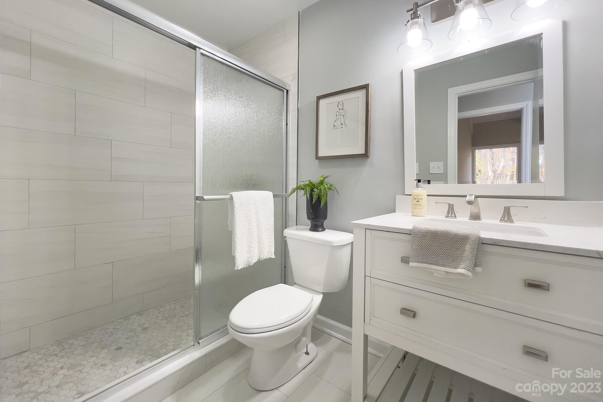 4719 Rounding Run Road Charlotte, NC 28277 - Photo 30 of 48 a bathroom with a sink toilet and shower