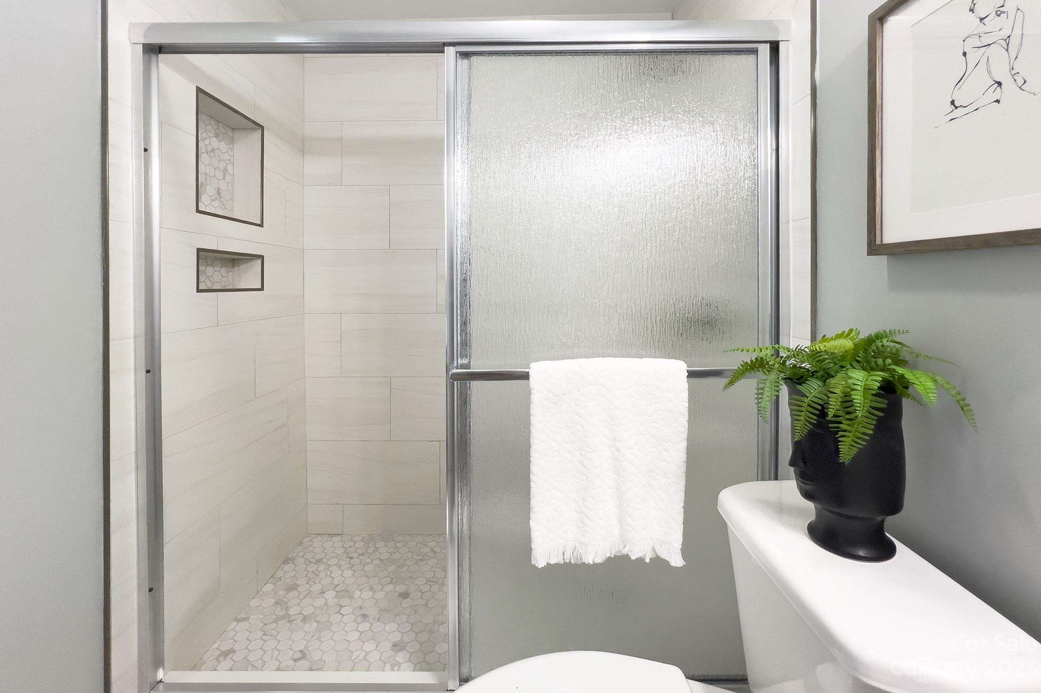 4719 Rounding Run Road Charlotte, NC 28277 - Photo 31 of 48 a bathroom with a shower and a toilet