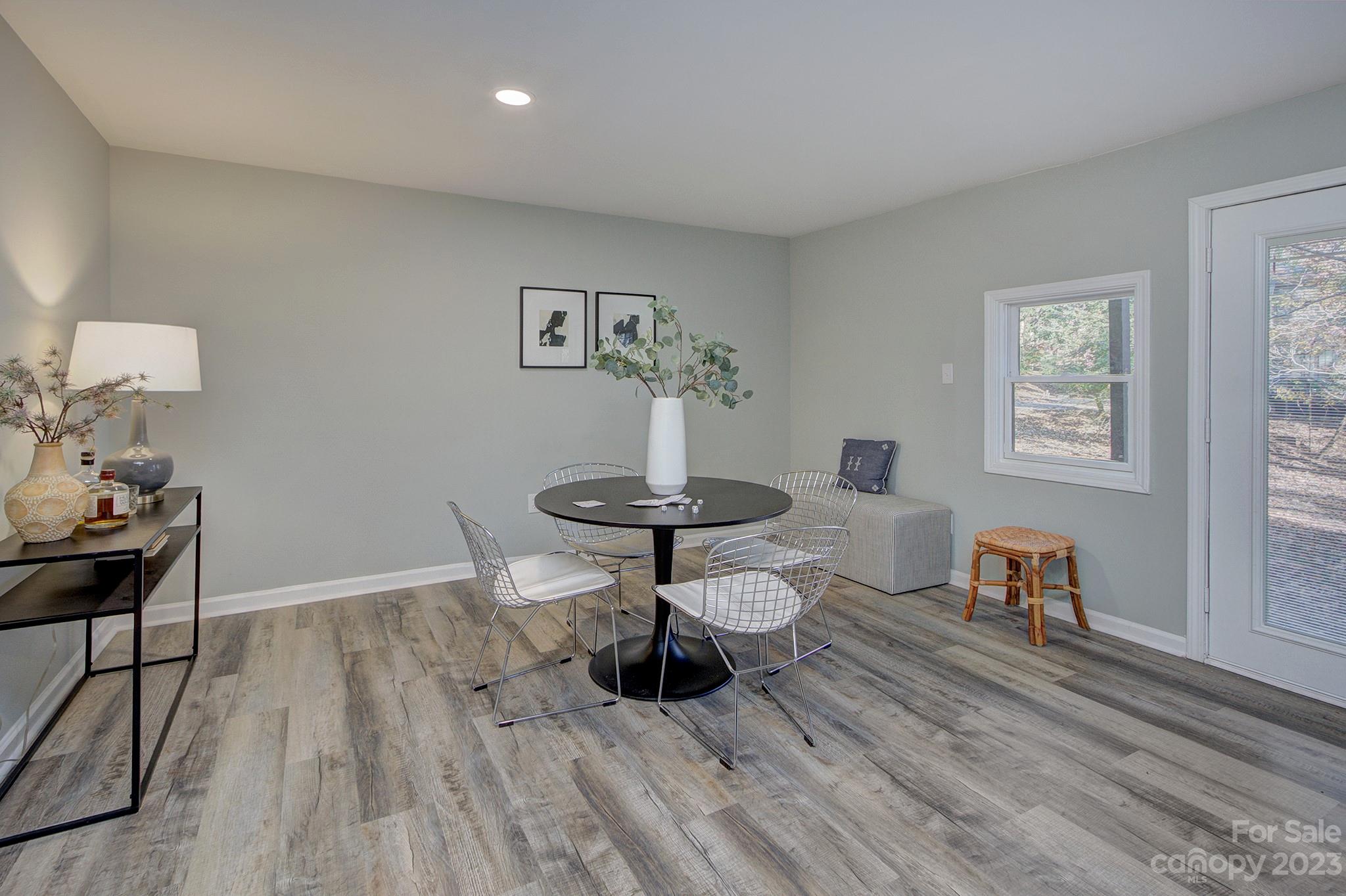 4719 Rounding Run Road Charlotte, NC 28277 - Photo 37 of 48 a living room with furniture and a wooden floor