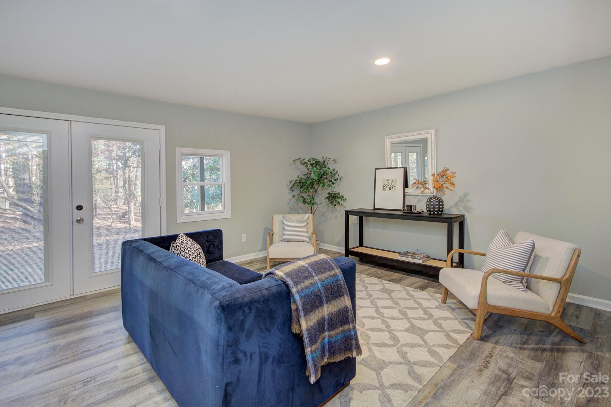 4719 Rounding Run Road Charlotte, NC 28277 - Photo 38 of 48 a living room with furniture and a potted plant