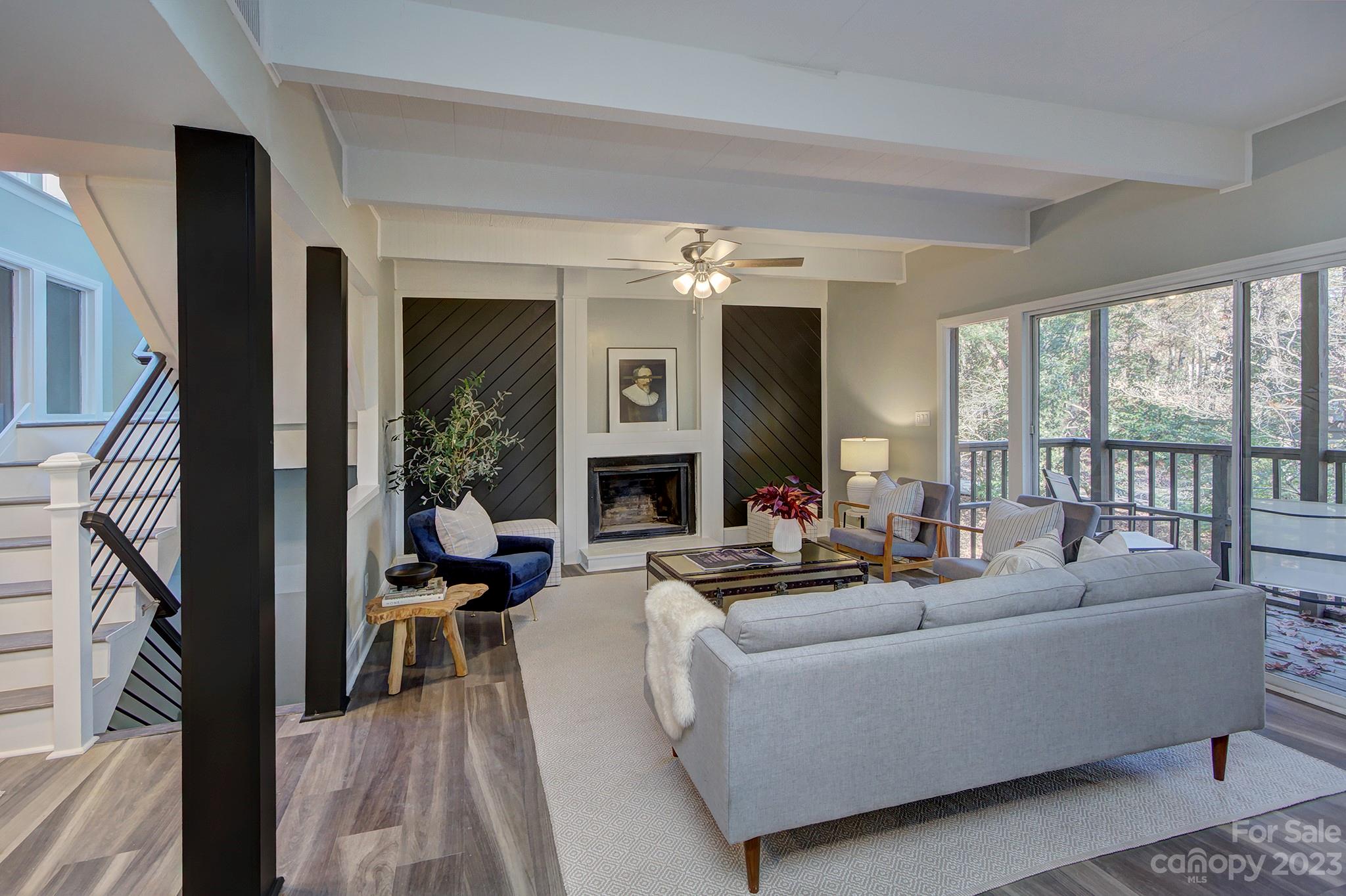4719 Rounding Run Road Charlotte, NC 28277 - Photo 7 of 48 a living room with fireplace furniture and a large window