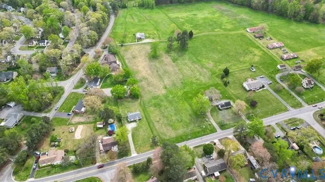 a view of house with backyard