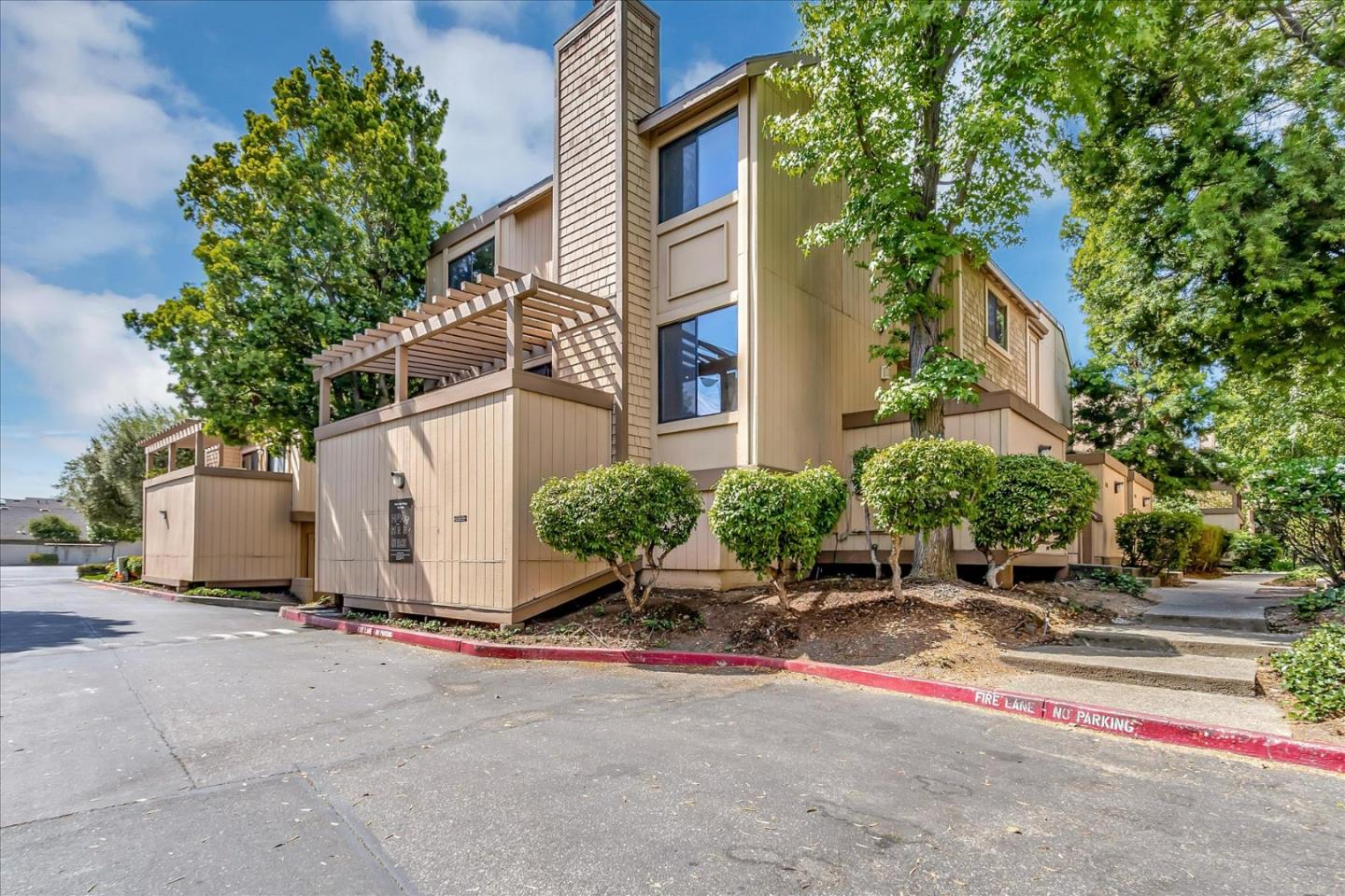 14566 South Bascom Avenue Los Gatos, CA 95032 - Photo 1 of 28 a row of palm trees in front of a building