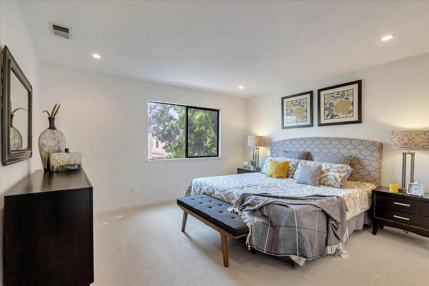 14566 South Bascom Avenue Los Gatos, CA 95032 - Photo 14 of 28 a bedroom with a bed and a window