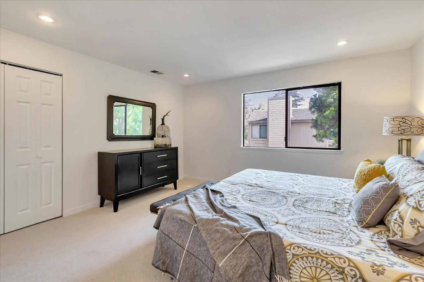 14566 South Bascom Avenue Los Gatos, CA 95032 - Photo 15 of 28 a bedroom with a bed and a window