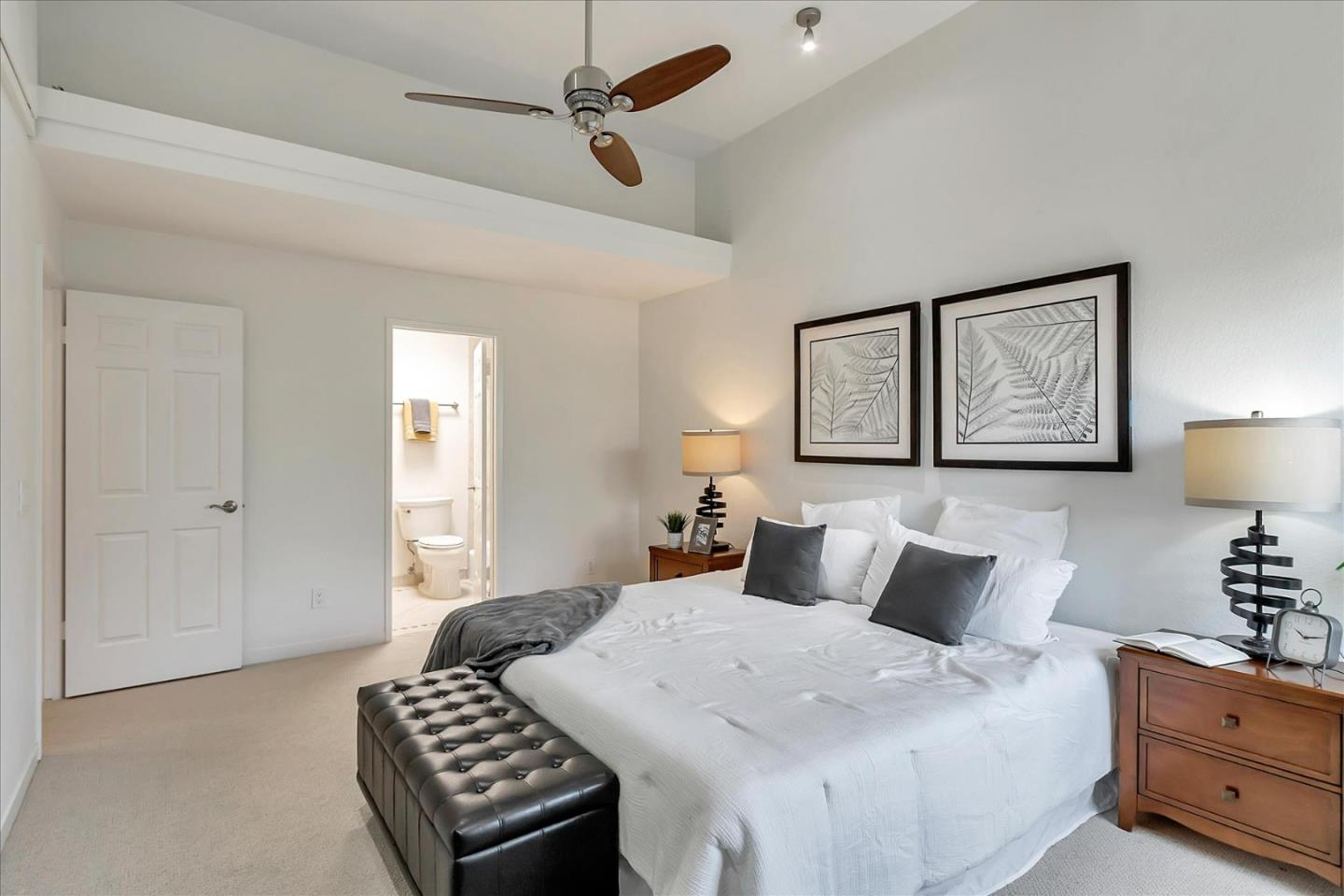 14566 South Bascom Avenue Los Gatos, CA 95032 - Photo 21 of 28 a bedroom with a bed and a lamp on dresser