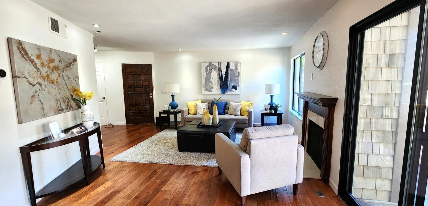 14566 South Bascom Avenue Los Gatos, CA 95032 - Photo 6 of 28 a living room with furniture wooden floor and a flat screen tv