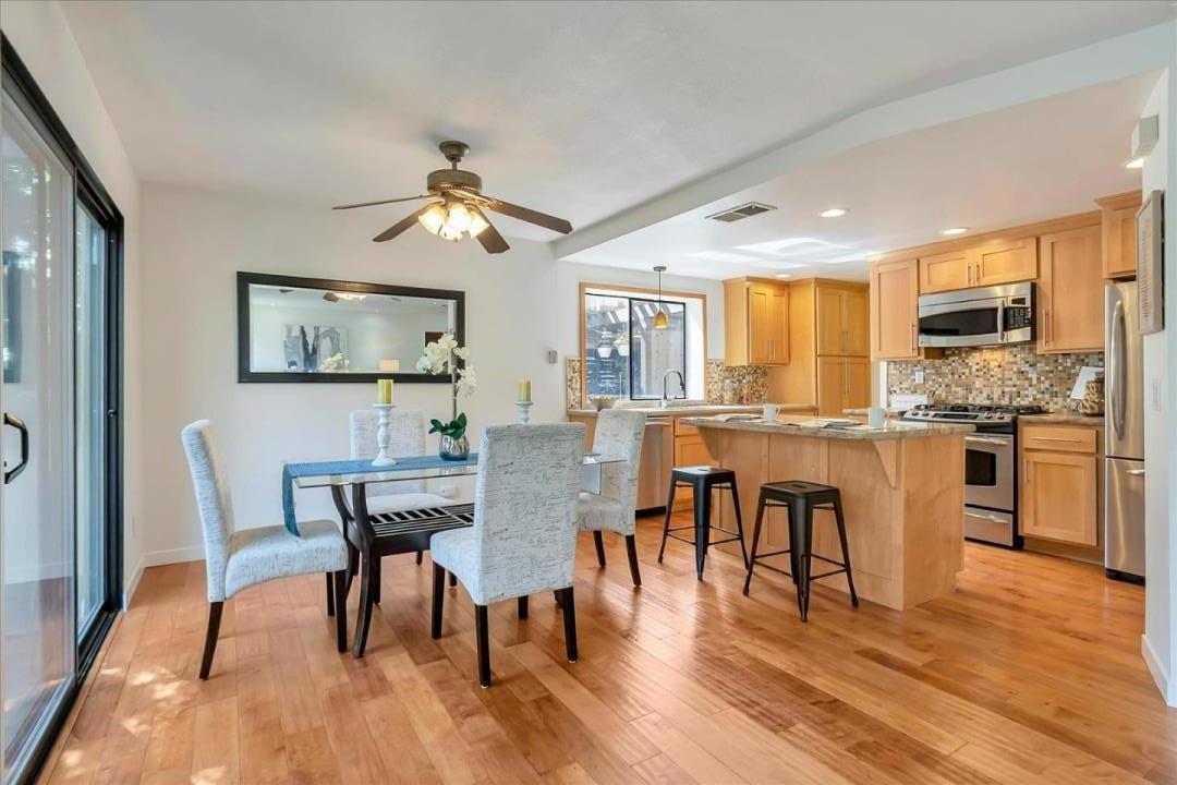 14566 South Bascom Avenue Los Gatos, CA 95032 - Photo 7 of 28 a view of a dining room with furniture window and wooden floor