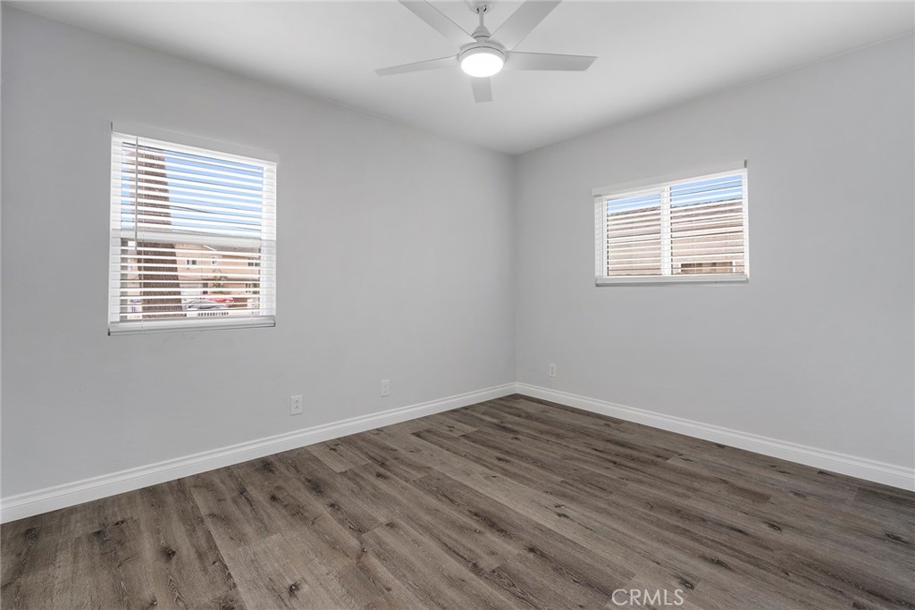9131 Hall Road Downey, CA 90241 - Photo 25 of 32 a view of an empty room with wooden floor and a window