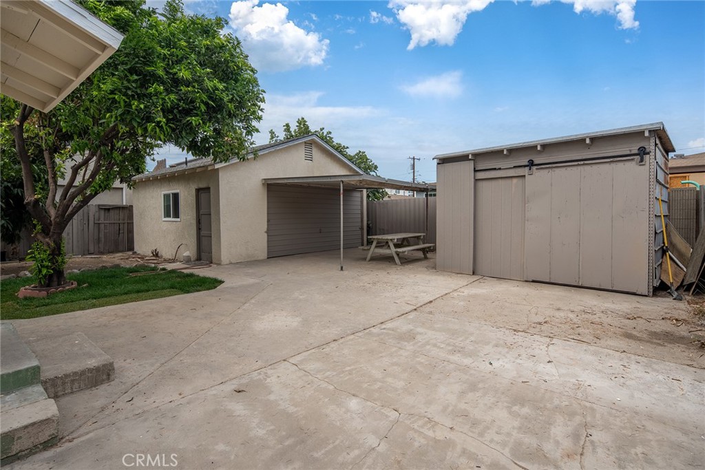 9131 Hall Road Downey, CA 90241 - Photo 27 of 32 a view of a house with a yard and garage