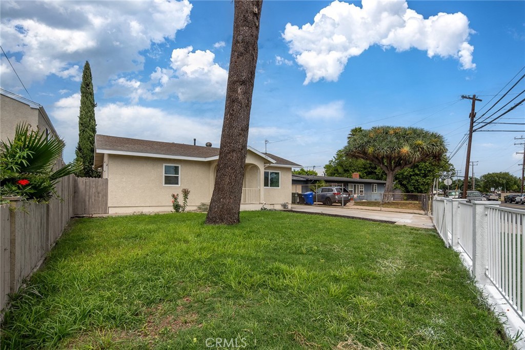 9131 Hall Road Downey, CA 90241 - Photo 4 of 32 a front view of a house with garden