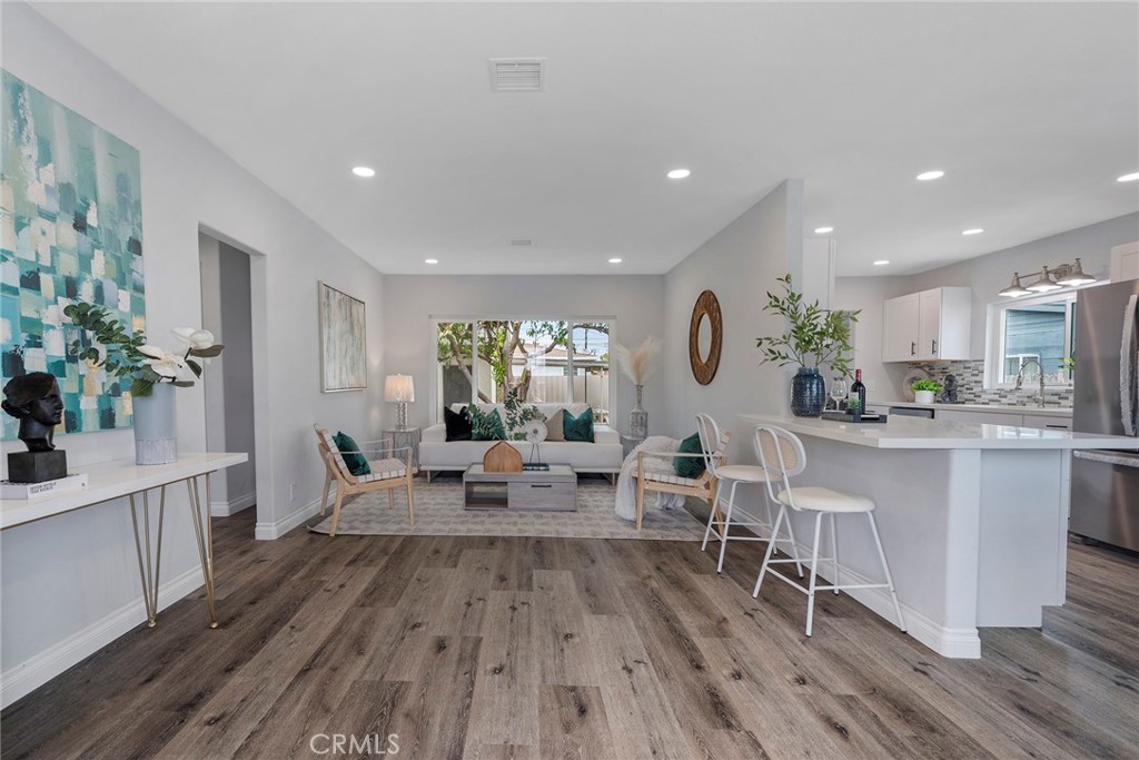 9131 Hall Road Downey, CA 90241 - Photo 5 of 32 a living room with furniture and a wooden floor