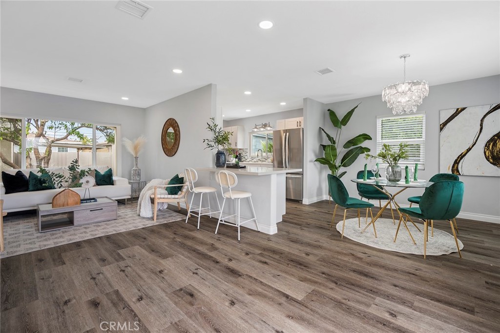 9131 Hall Road Downey, CA 90241 - Photo 6 of 32 a living room with furniture kitchen view and a large window
