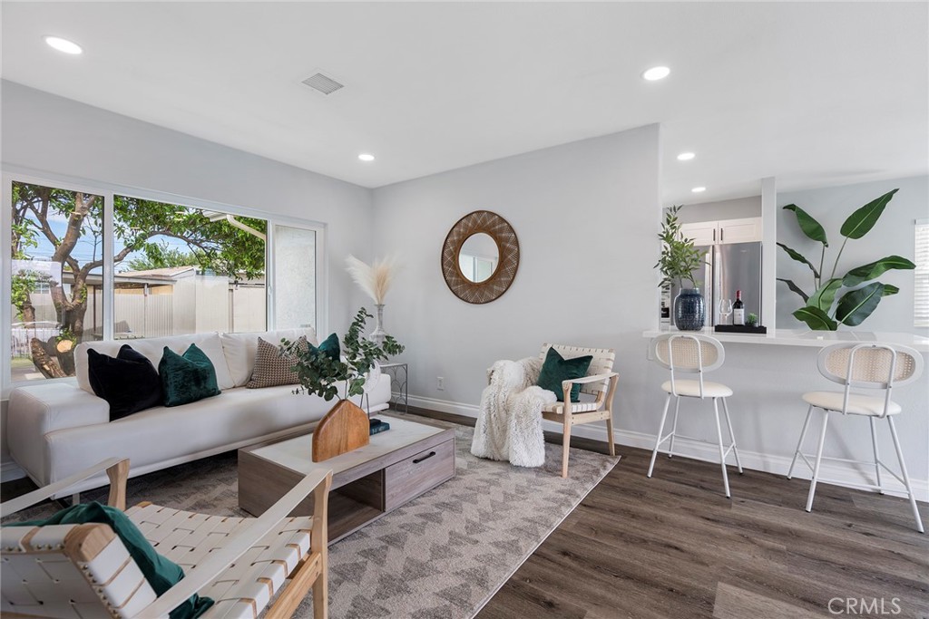 9131 Hall Road Downey, CA 90241 - Photo 8 of 32 a living room with furniture and a large window