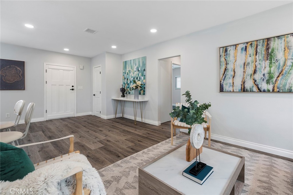 9131 Hall Road Downey, CA 90241 - Photo 10 of 32 a living room with furniture and a potted plant