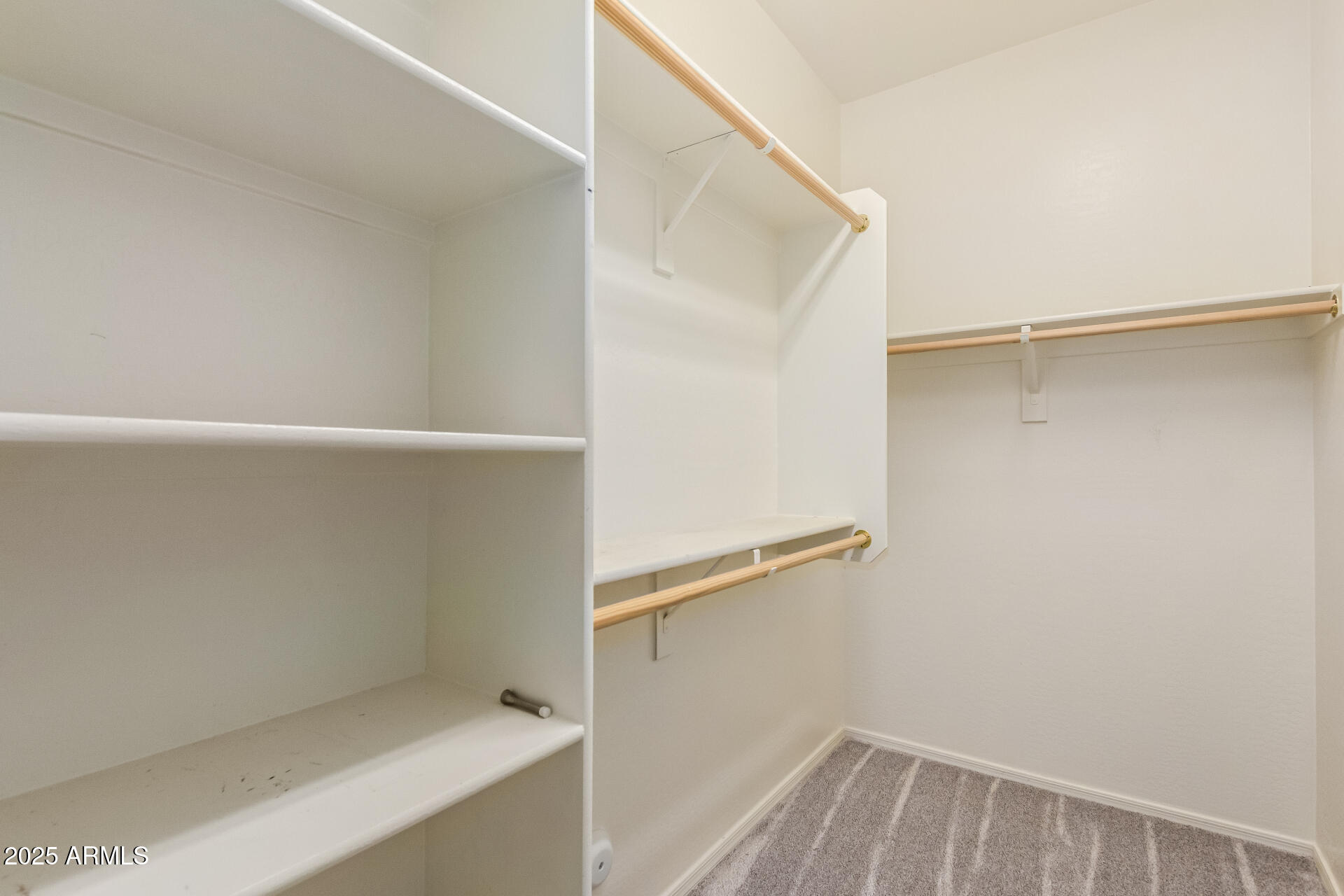 2536 West Gary Way Phoenix, AZ 85041 - Photo 18 of 26 a view of walk in closet with empty racks