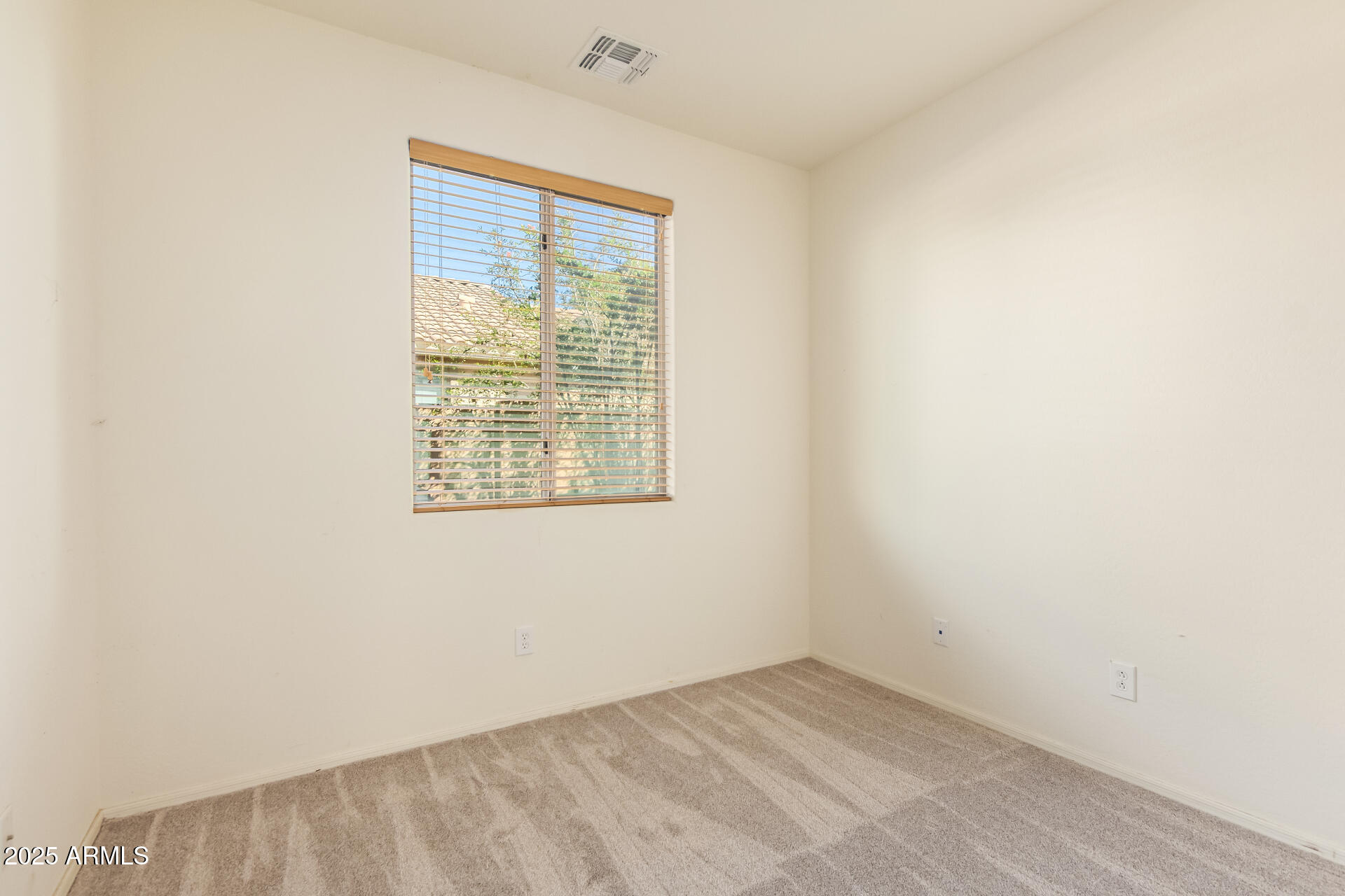 2536 West Gary Way Phoenix, AZ 85041 - Photo 19 of 26 an empty room with a window