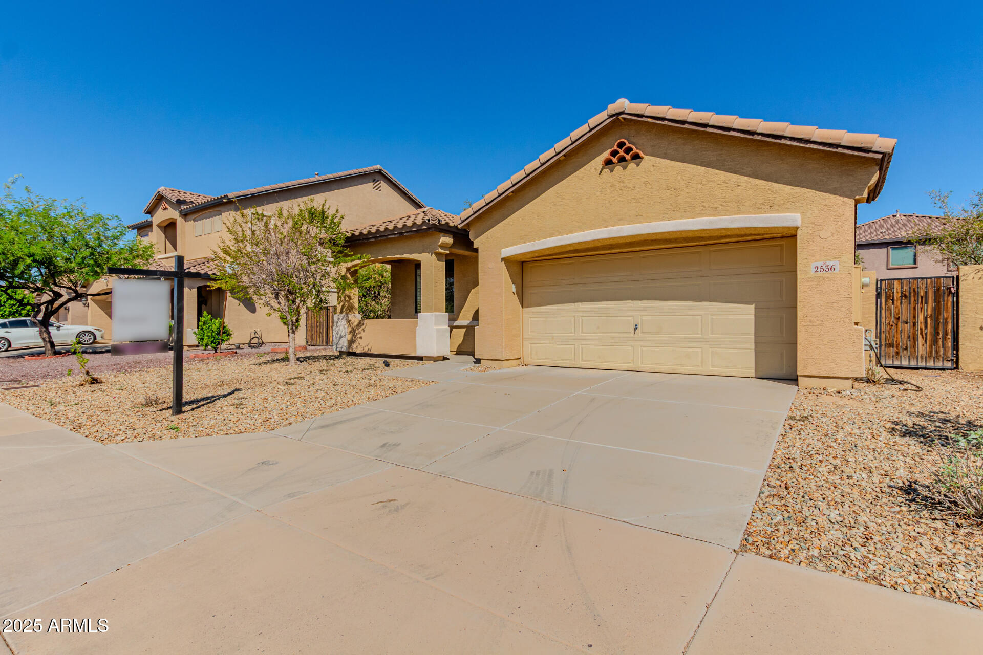 2536 West Gary Way Phoenix, AZ 85041 - Photo 2 of 26 a front view of a house with a garage