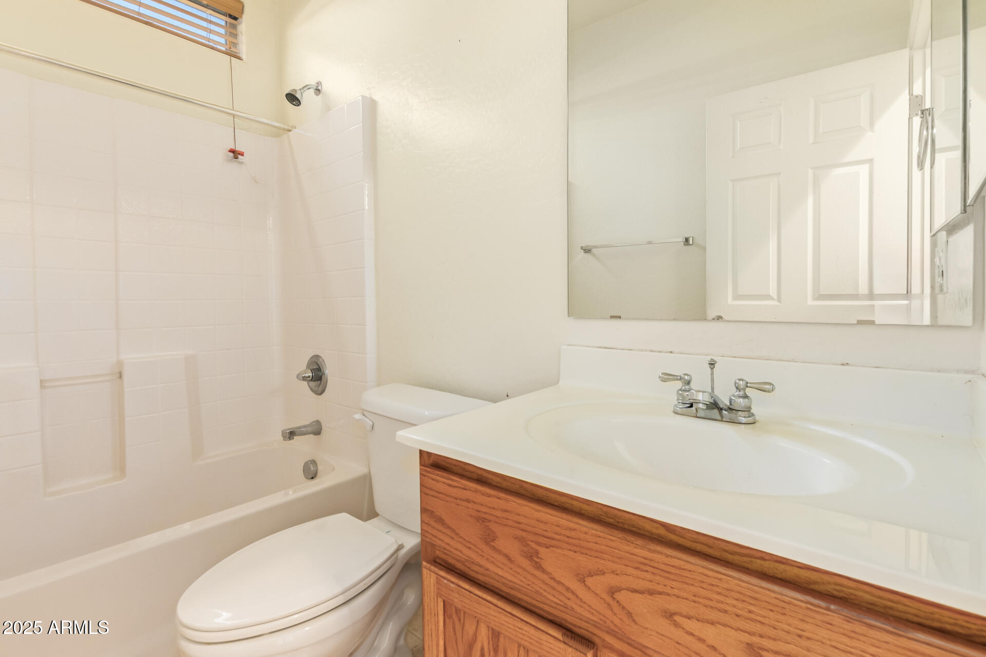 2536 West Gary Way Phoenix, AZ 85041 - Photo 21 of 26 a bathroom with a sink a toilet and shower