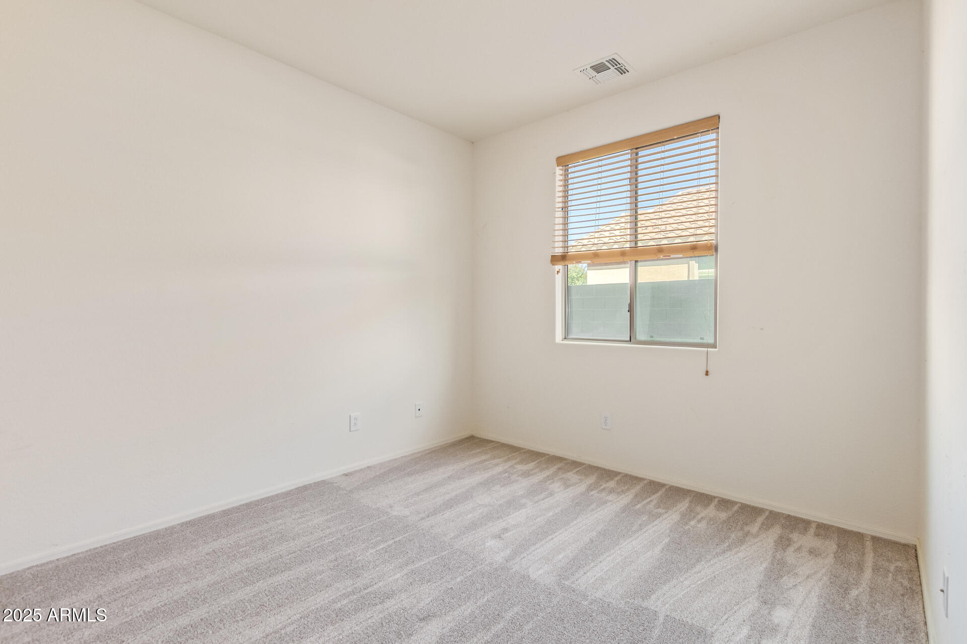 2536 West Gary Way Phoenix, AZ 85041 - Photo 22 of 26 an empty room with a window