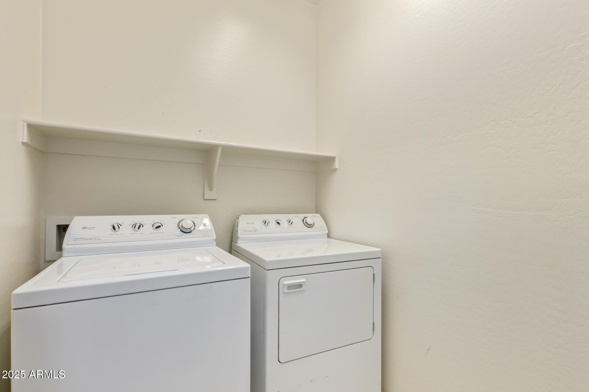 2536 West Gary Way Phoenix, AZ 85041 - Photo 24 of 26 a utility room with dryer and washer
