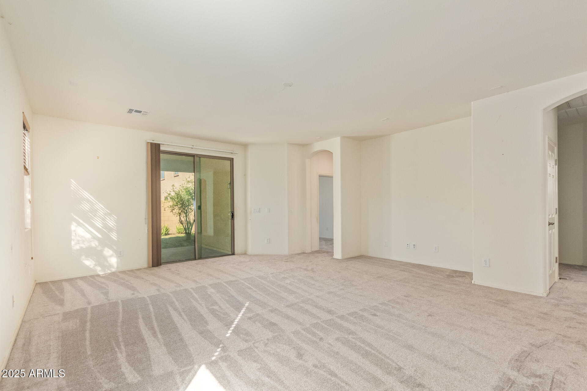 2536 West Gary Way Phoenix, AZ 85041 - Photo 4 of 26 a view of an empty room with a window