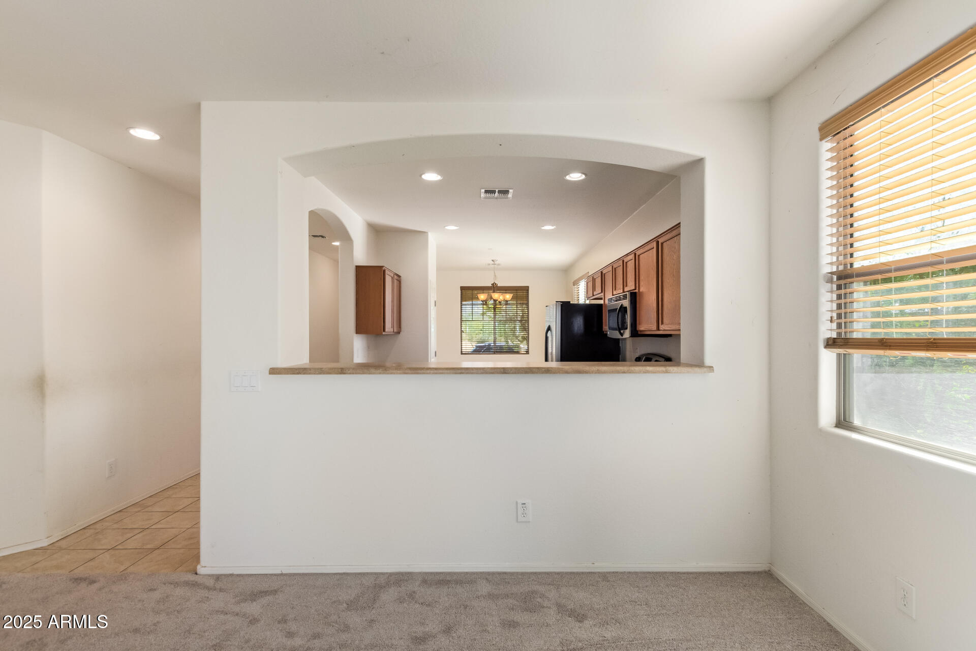 2536 West Gary Way Phoenix, AZ 85041 - Photo 8 of 26 a view of a living room with furniture and a window