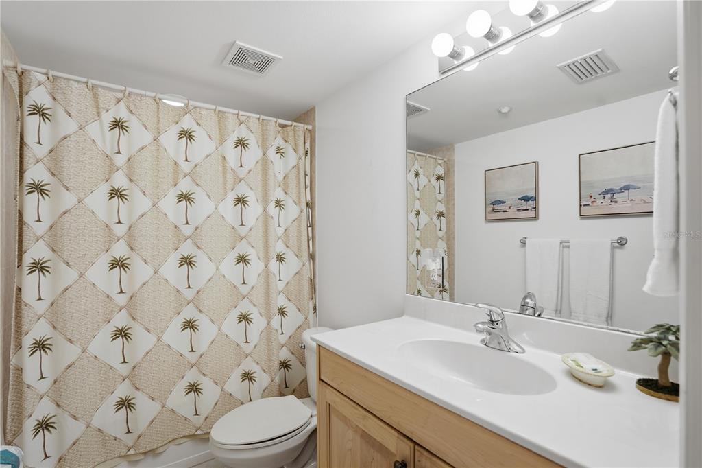 16326 Gulf Boulevard, Unit 307 Redington Beach, FL 33708 - Photo 29 of 43 a bathroom with a sink toilet and shower