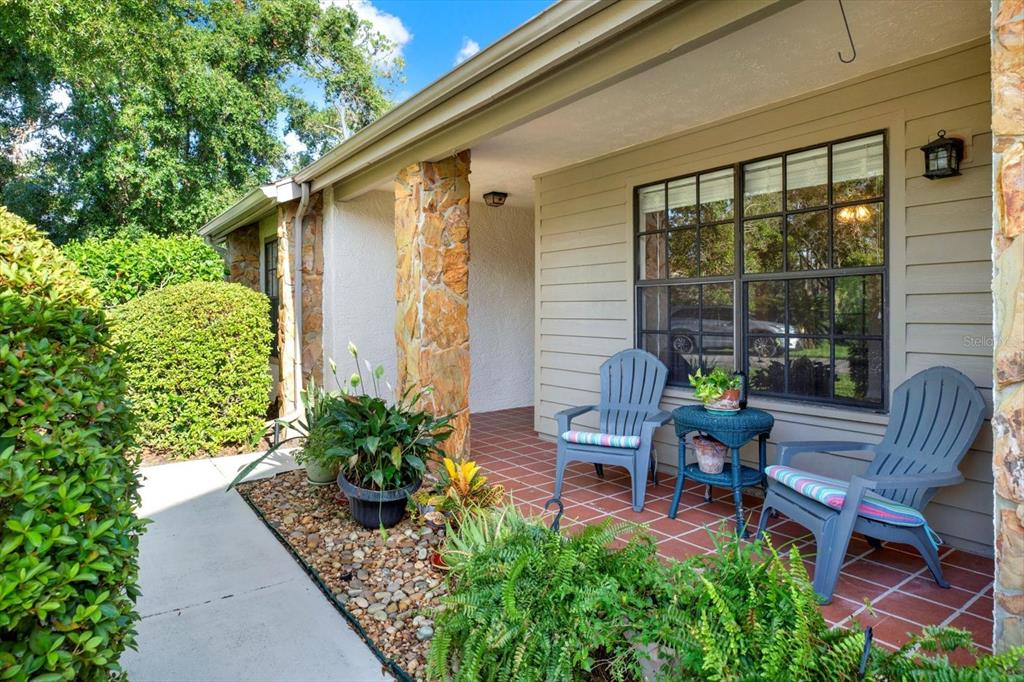 6654 Brambleleaf Drive Spring Hill, FL 34606 - Photo 18 of 27 a view of a house with backyard sitting area and garden