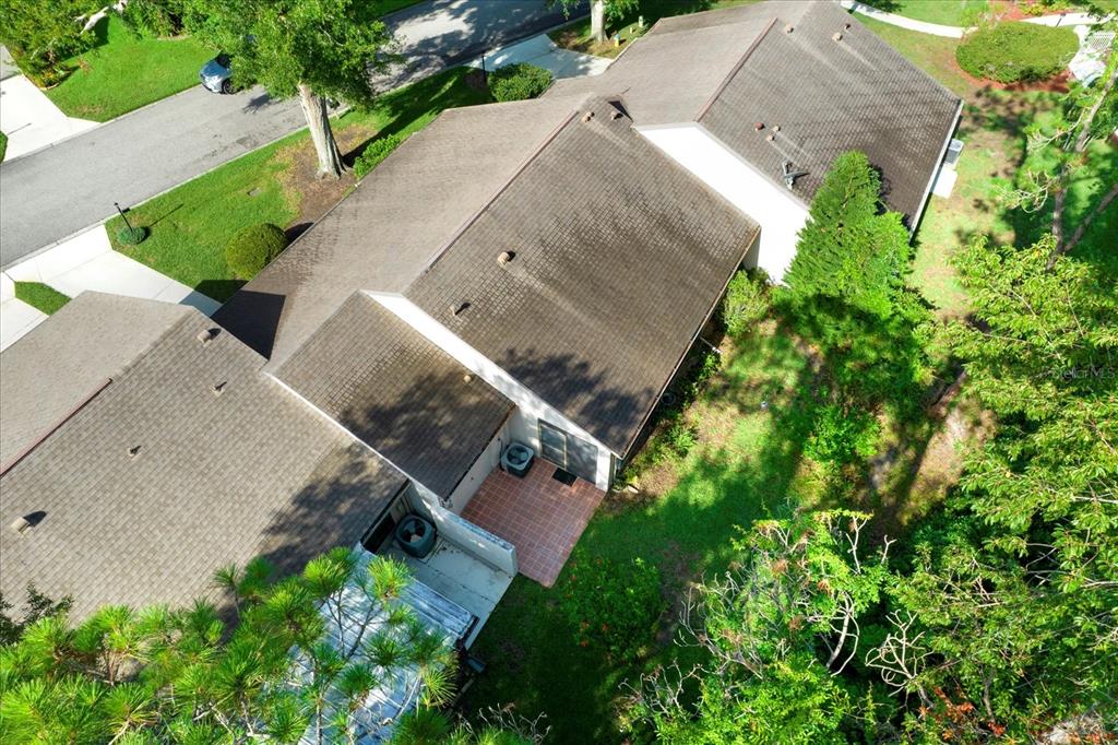6654 Brambleleaf Drive Spring Hill, FL 34606 - Photo 21 of 27 an aerial view of a house with a yard and a large tree