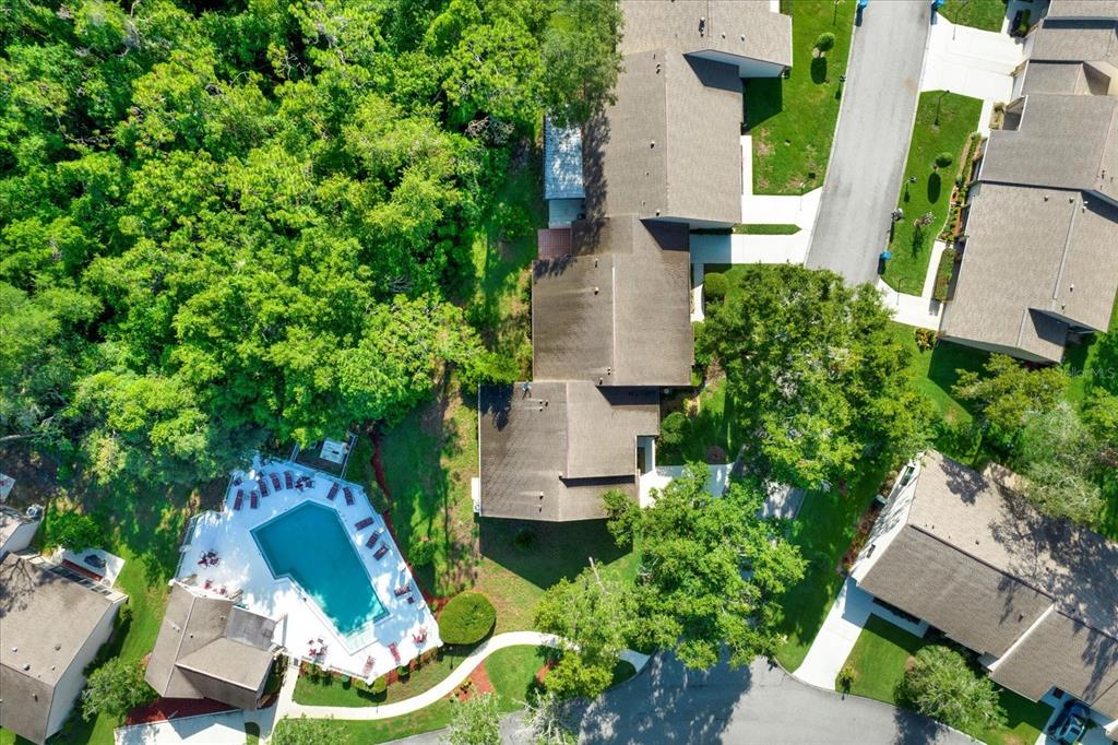 6654 Brambleleaf Drive Spring Hill, FL 34606 - Photo 23 of 27 an aerial view of a house with a yard and lake view