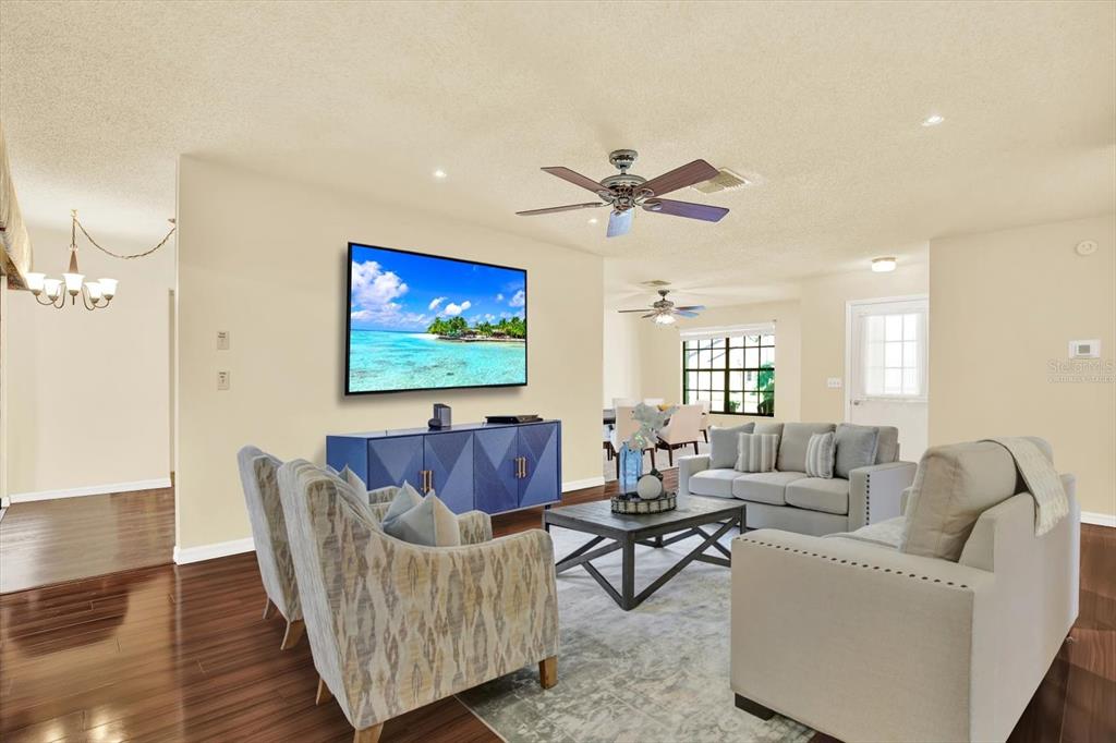 6654 Brambleleaf Drive Spring Hill, FL 34606 - Photo 24 of 27 a living room with furniture and a large window