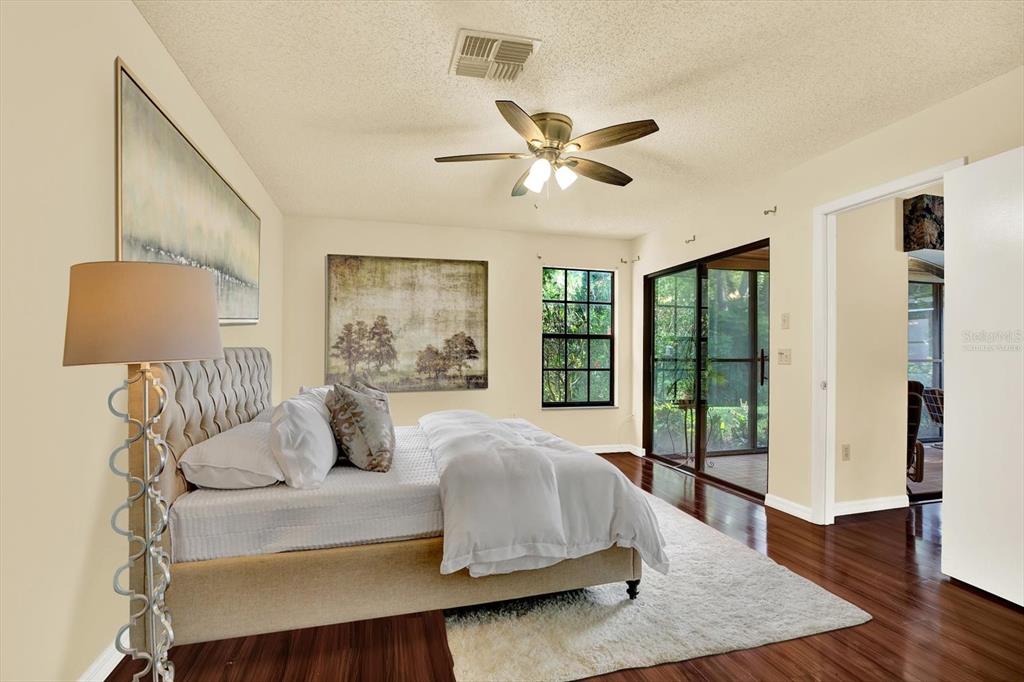6654 Brambleleaf Drive Spring Hill, FL 34606 - Photo 26 of 27 a bedroom with a large bed and a window