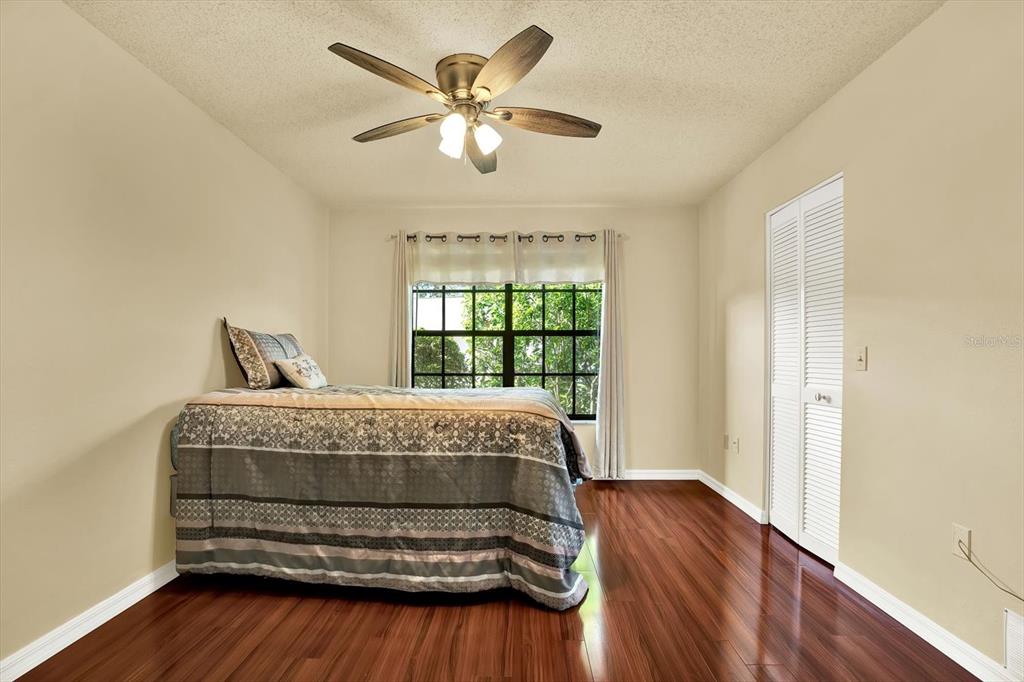 6654 Brambleleaf Drive Spring Hill, FL 34606 - Photo 9 of 27 a bedroom with a bed and window