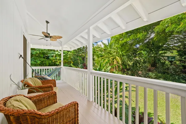a balcony view with a seating space