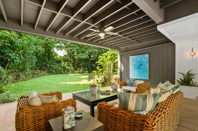 a view of an outdoor sitting area with furniture and garden