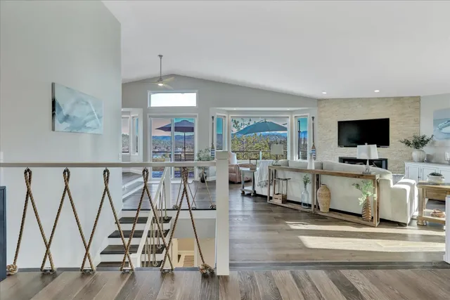 a kitchen with refrigerator a sink and chairs