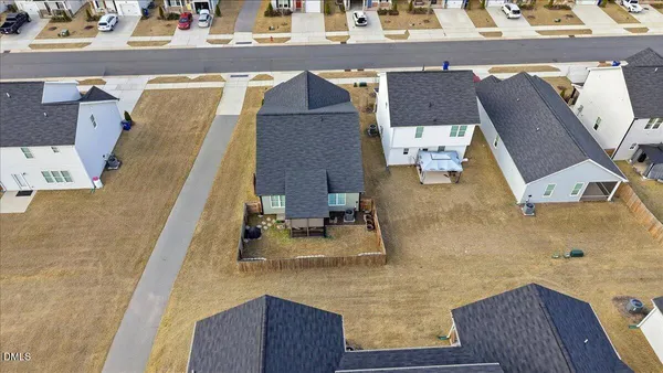 an aerial view of residential houses with outdoor space