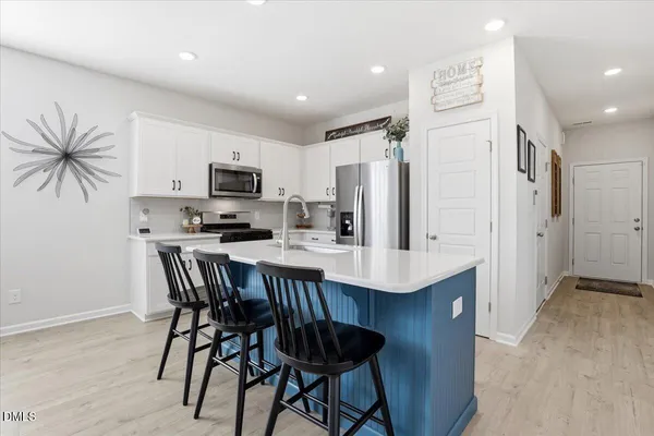 a kitchen with lots of counter top space and appliances