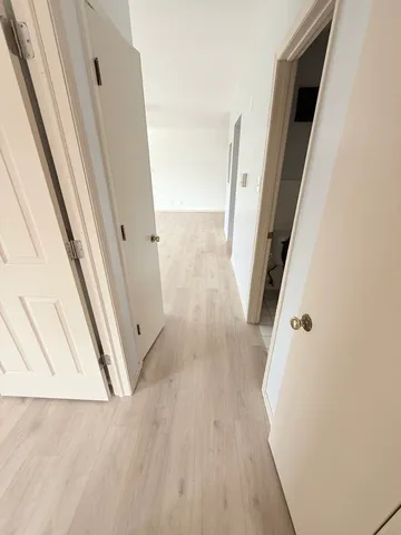 view of a room with wooden floor
