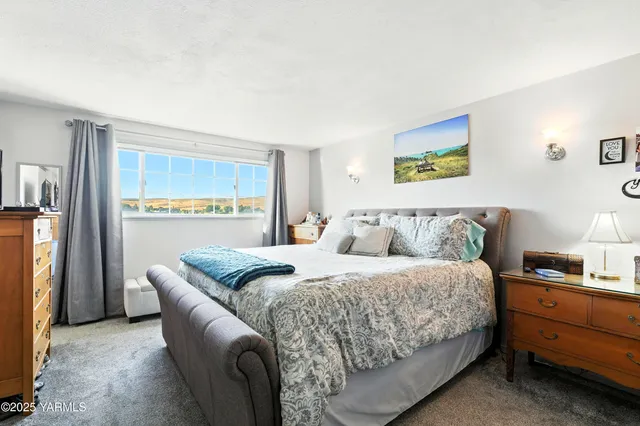 a bedroom with a bed and a couch