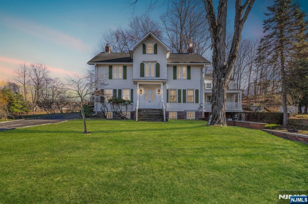 265 Little Falls Road Cedar Grove, NJ 07009 - Photo 1 of 44 a front view of a house with a yard
