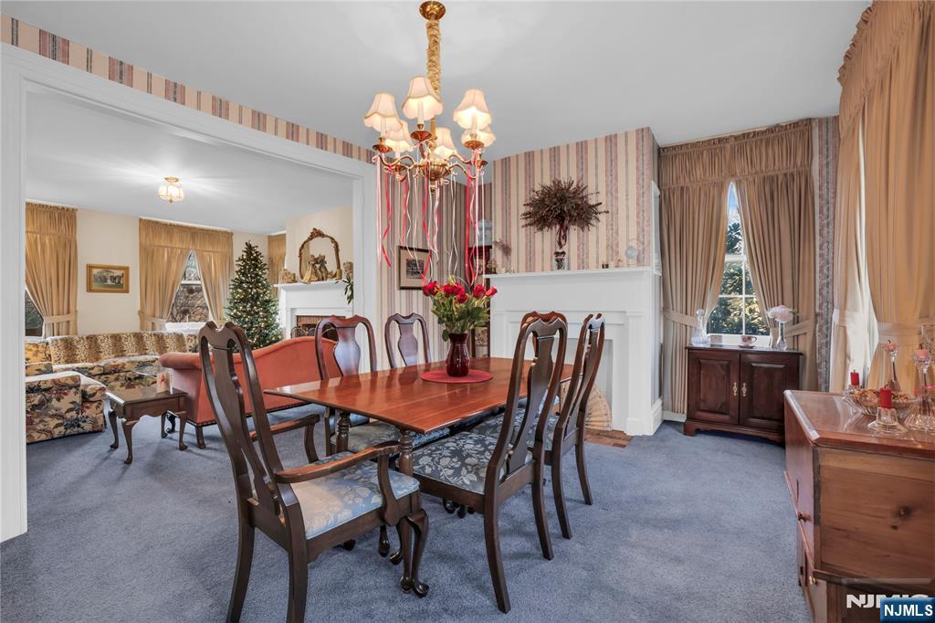 265 Little Falls Road Cedar Grove, NJ 07009 - Photo 14 of 44 a dining room with furniture a chandelier and window
