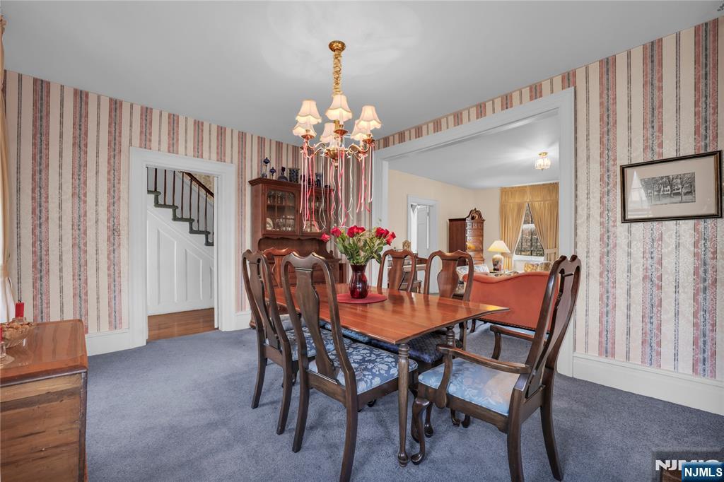 265 Little Falls Road Cedar Grove, NJ 07009 - Photo 15 of 44 a view of a dining room with furniture and chandelier